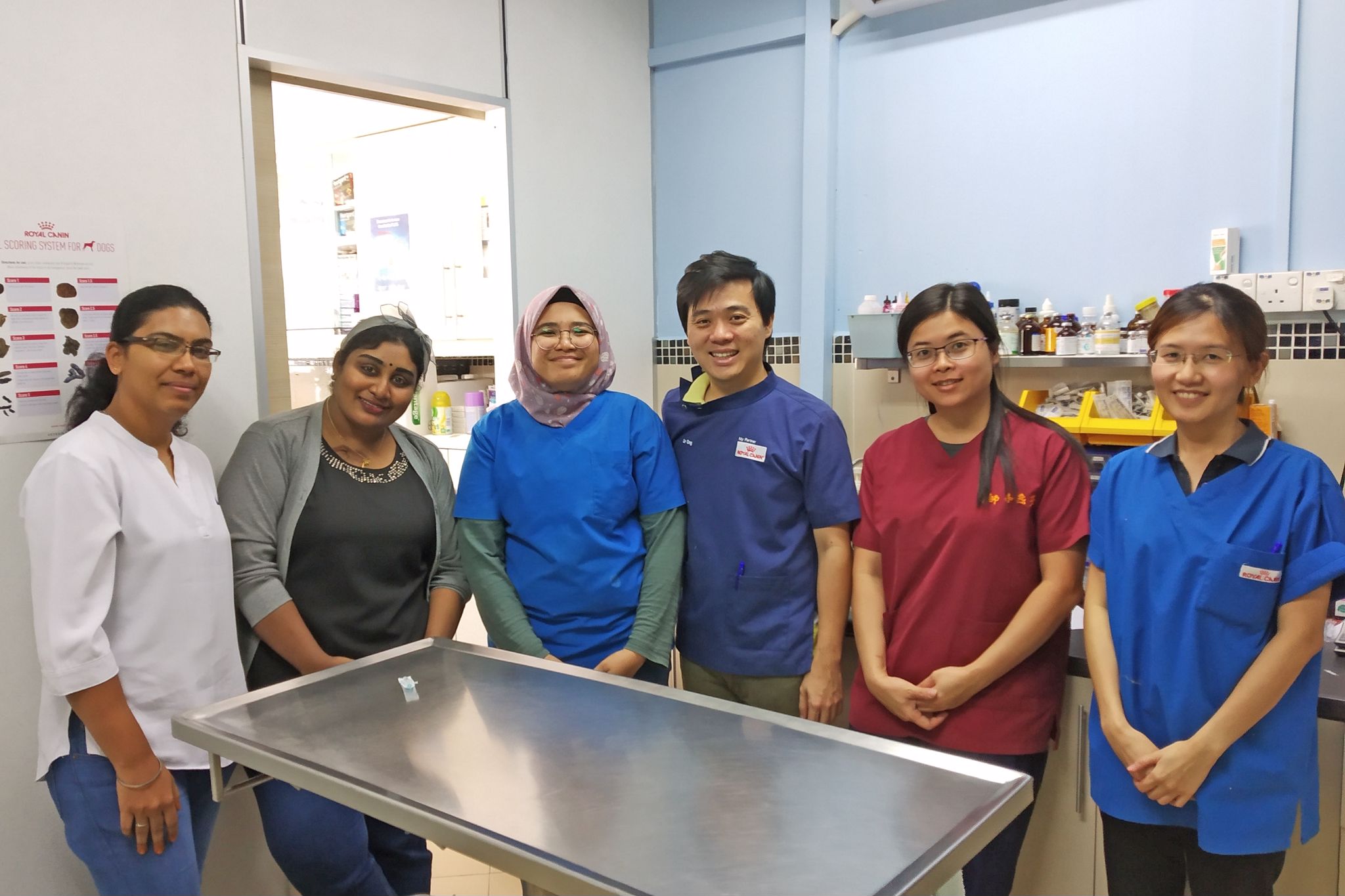 A photo of Shivam with the team behind Putra Heights Veterinary Clinic.