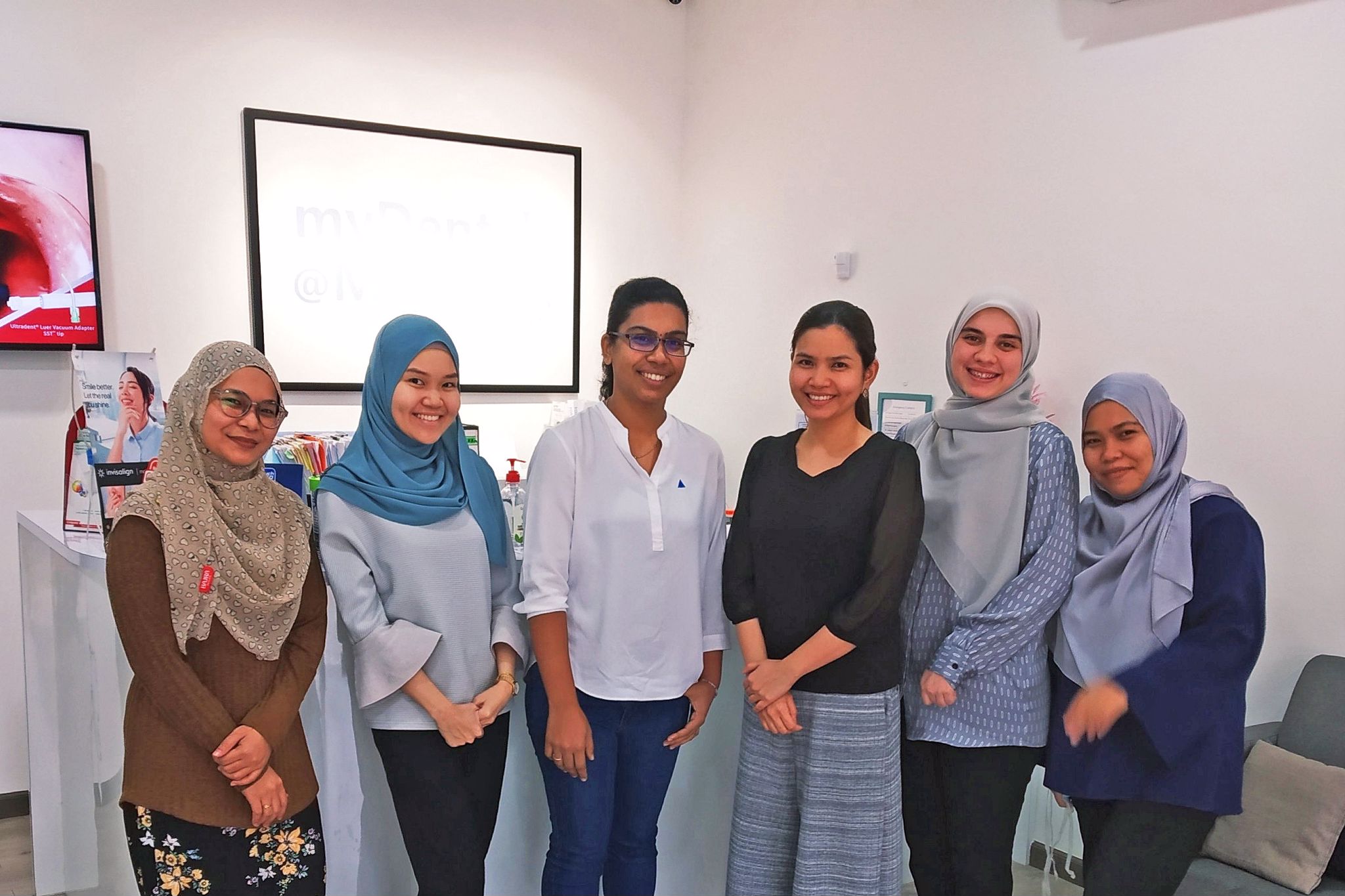 A photo of Shivam together with the team behind Klinik Pergigian myDental@Melati.