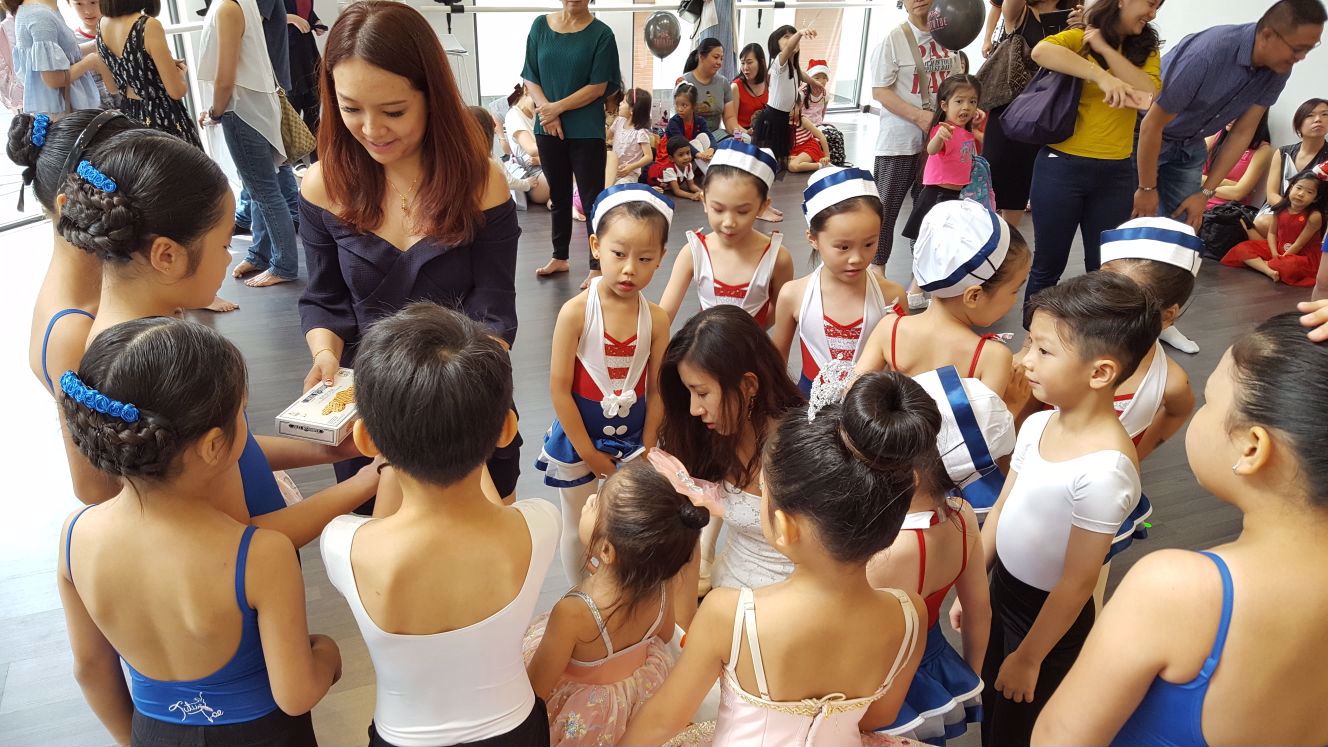 Jess & Queennie from Tutu Toe Dance Academy distributing Christmas gifts to their students after the Grand Opening of their second branch at Desa Park City.   