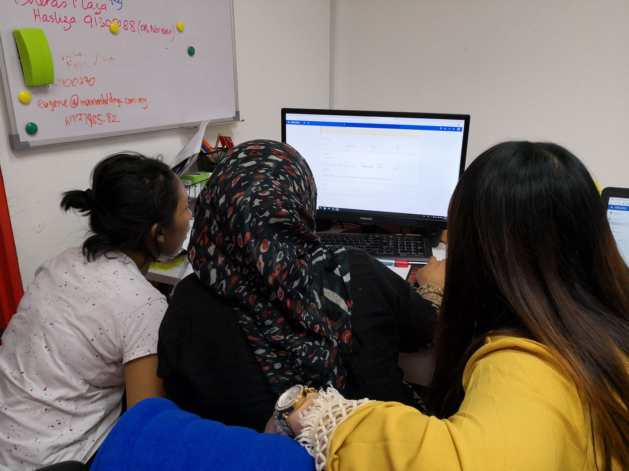 Ms. Ong from Proline Cleaning Solutions is a very patient young entrepreneur, here she is guiding her employees on using modern software.