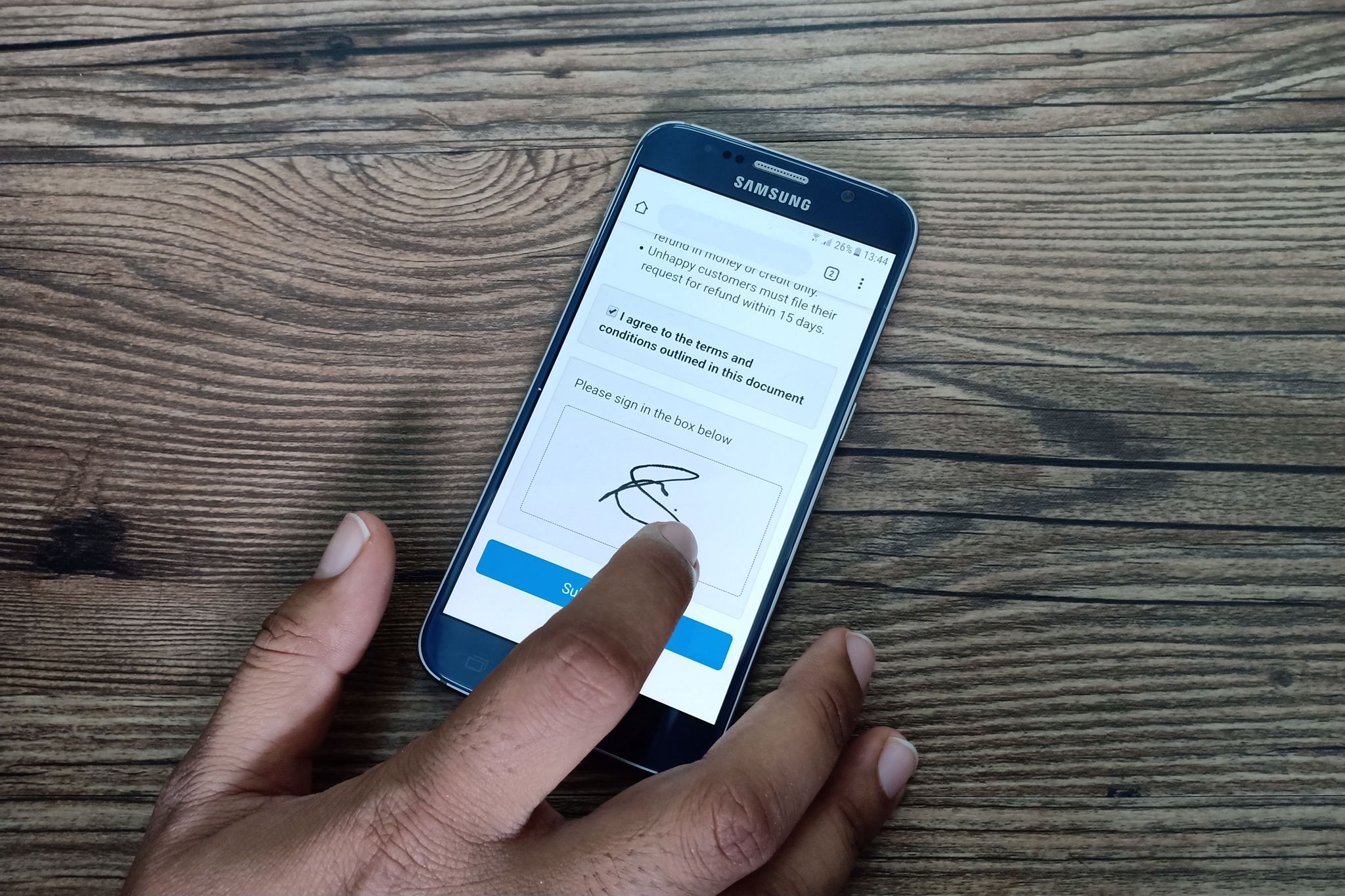 A customer signing a digital consent form using Kreloses. Customers can now sign forms digitally on their devices and this will help to reduce paper consumption.