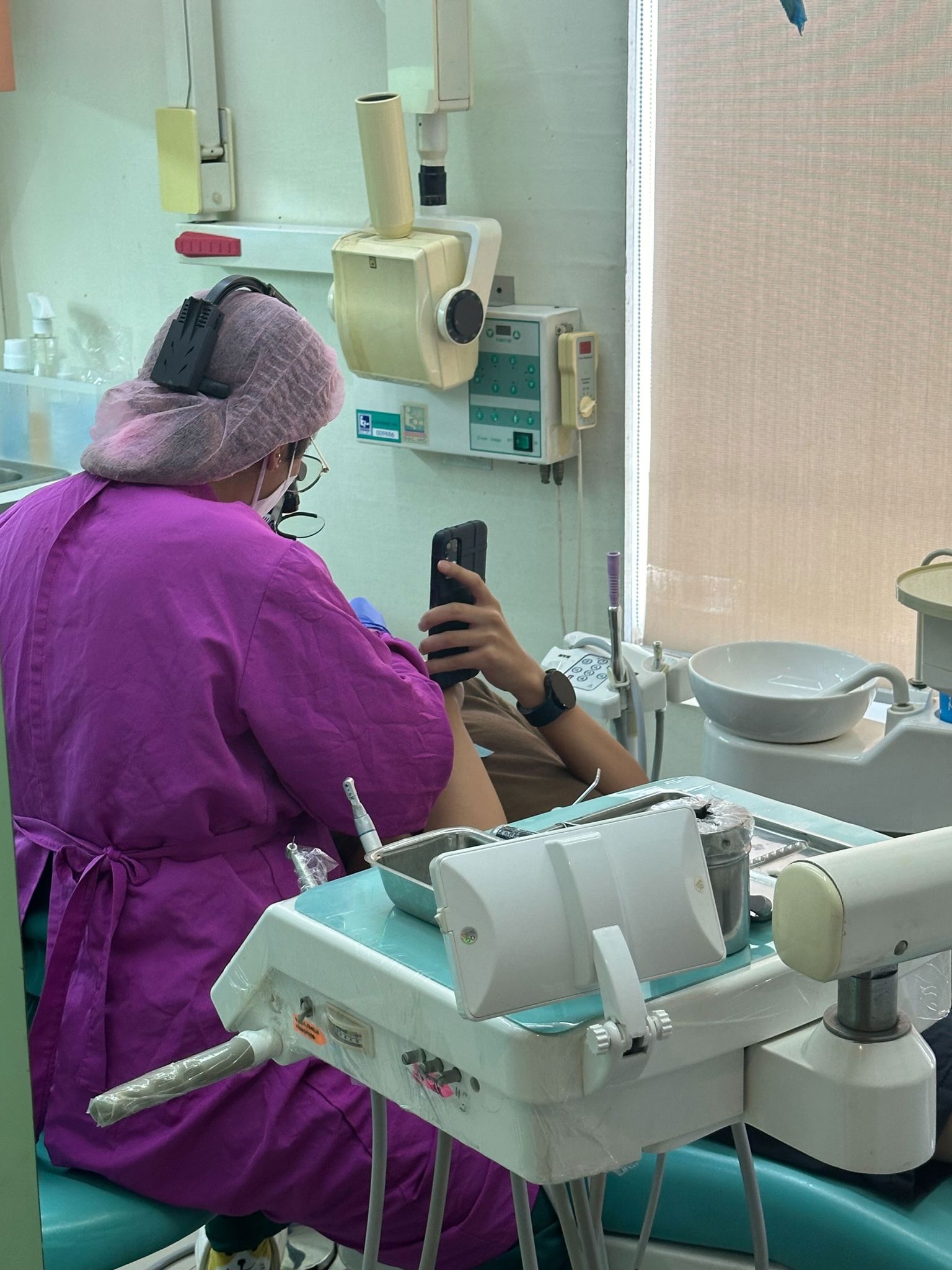 Dr. Thea while attending to a patient