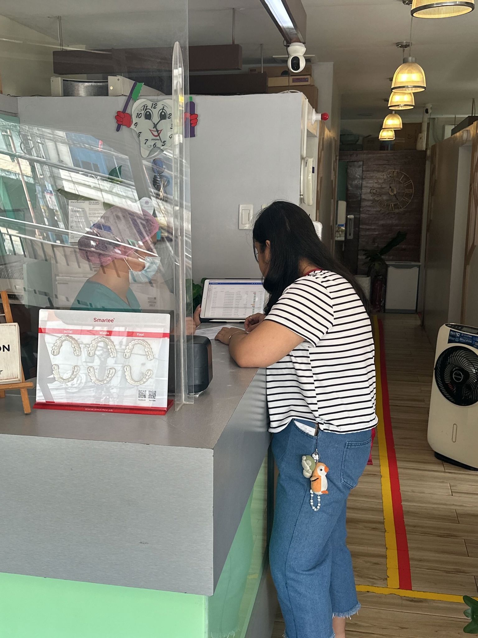 Ms. Joy discussing the bill with the patient